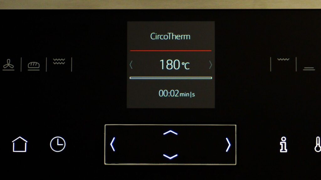 Digital oven temperature screen. Oven set to 180 degrees Celsius.